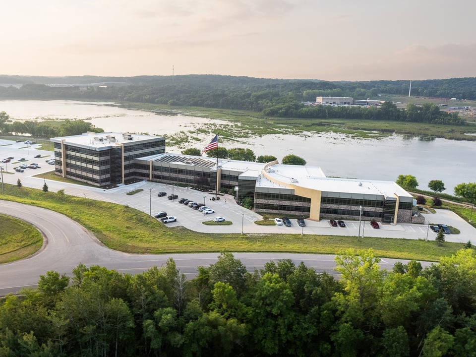 Drone shot from above Blattner office complex with lake in the background