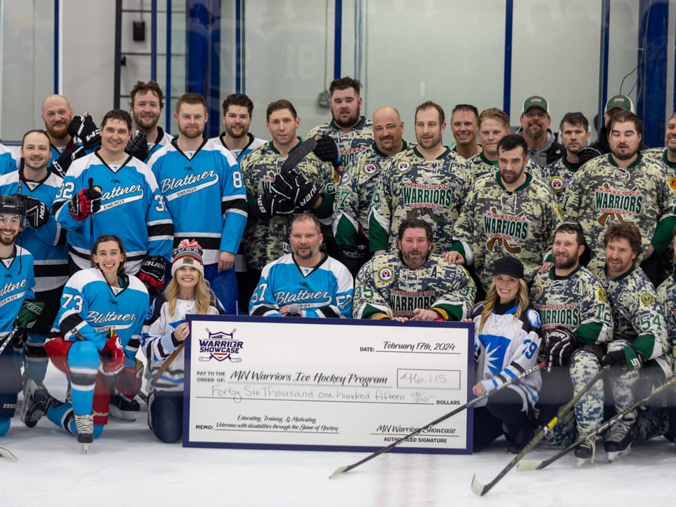 Hockey teams shown on arena ice being presented with a donation check