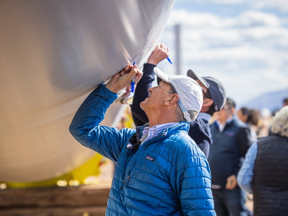 Project team signing wind turbine ceremoniously