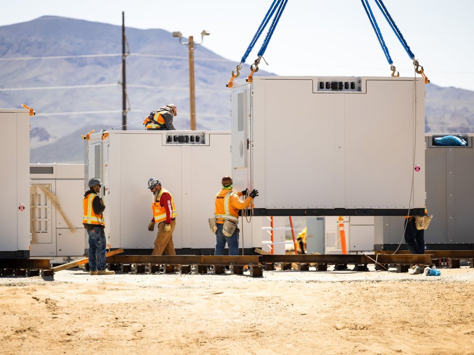 Storage units being lowered into place