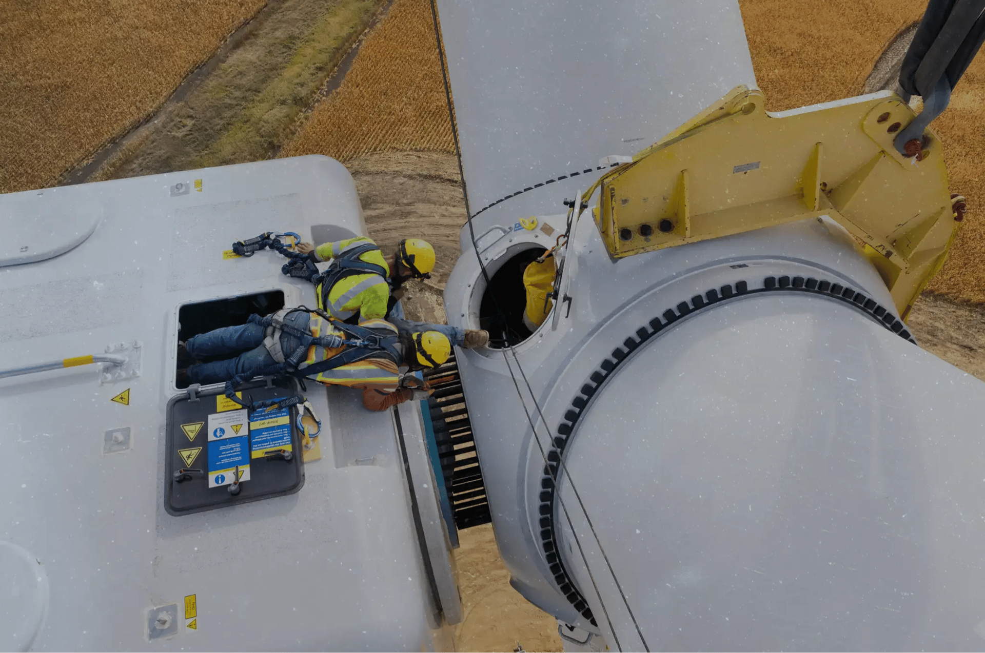 overhead view of workers on wind turbine